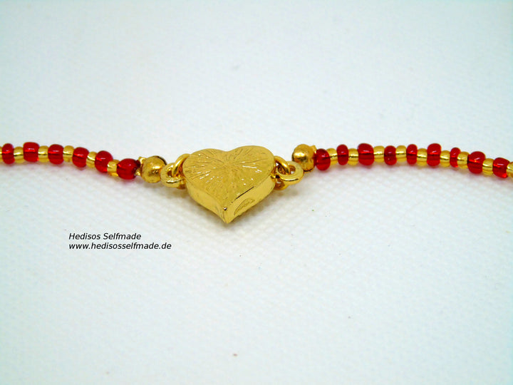 Edle Halskette, 60 cm, in rot-gold mit Glasanhänger, 7 cm, in rot, weiß und gold